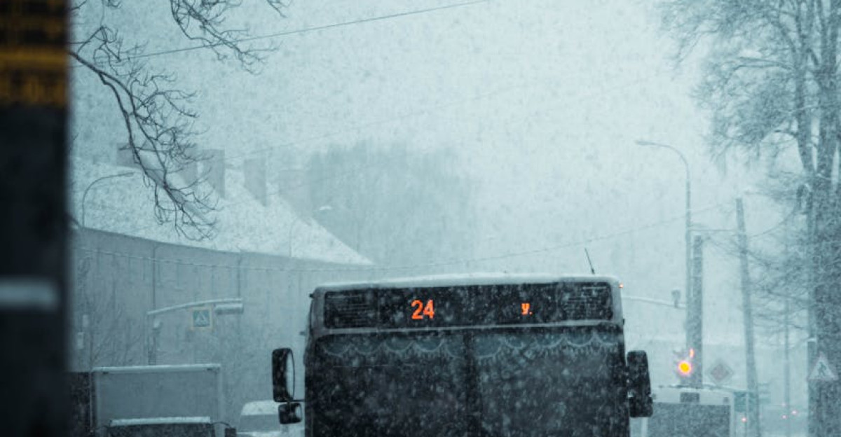 A public bus navigating through a snowy street in Kaliningrad Russia during daytime