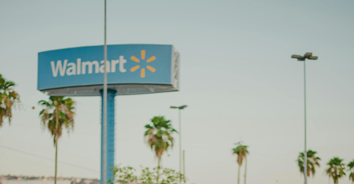 Couple playfully having fun in a parking lot with a Walmart sign in the background.