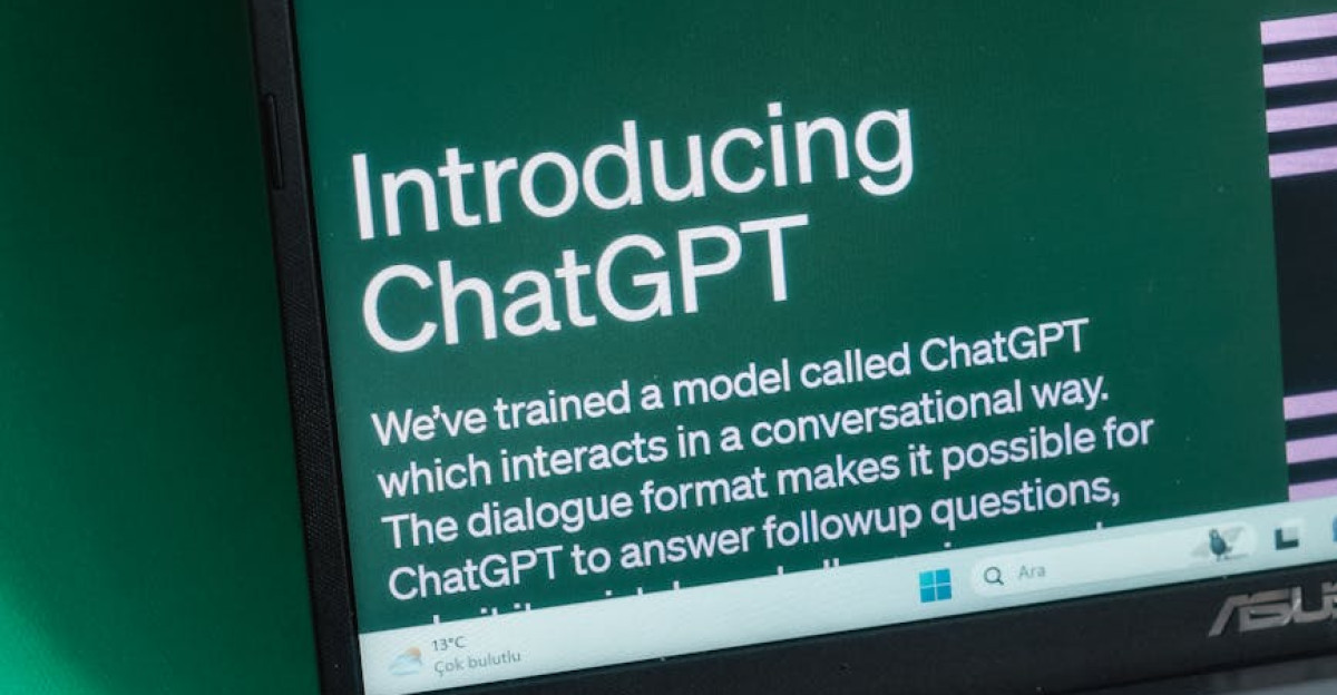 Laptop screen displaying the introductory page of ChatGPT on OpenAI s website