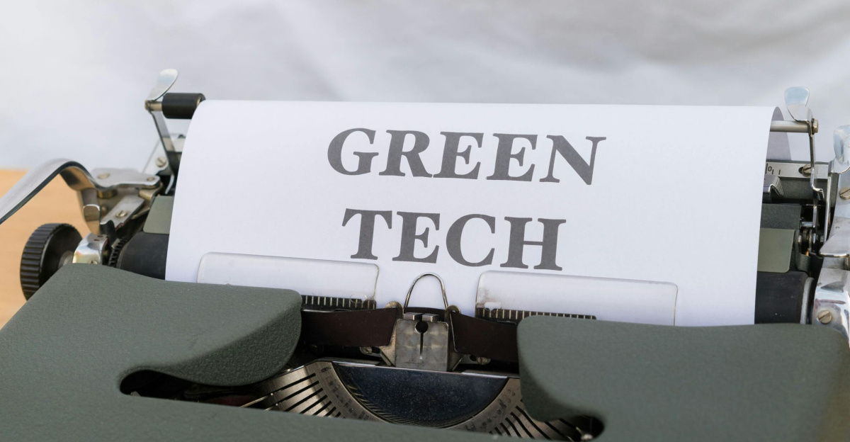 Vintage typewriter displaying the text 'Green Tech', symbolizing eco-friendly innovations.