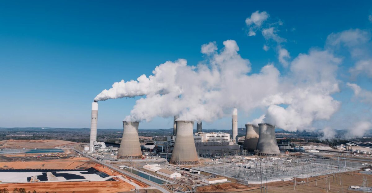 Aerial shot of an industrial power plant with smoke billowing in Euharlee Georgia