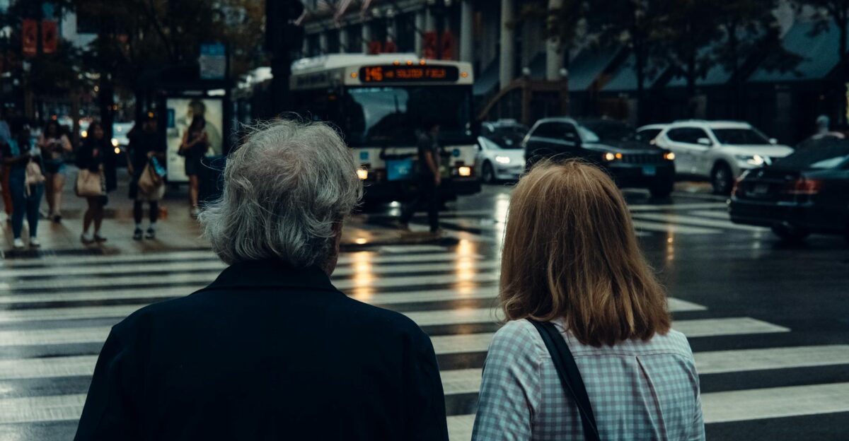 Busy Chicago intersection with pedestrians and traffic captured from behind