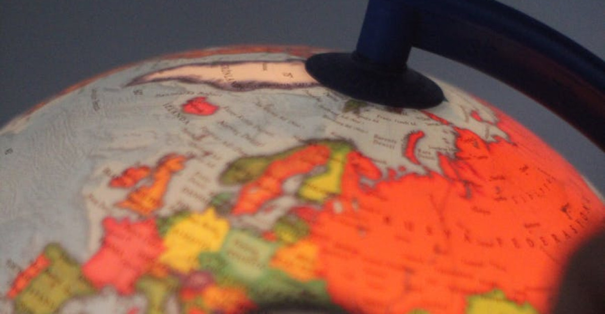 Globe with magnifying glass highlighting Turkey vibrant map colors