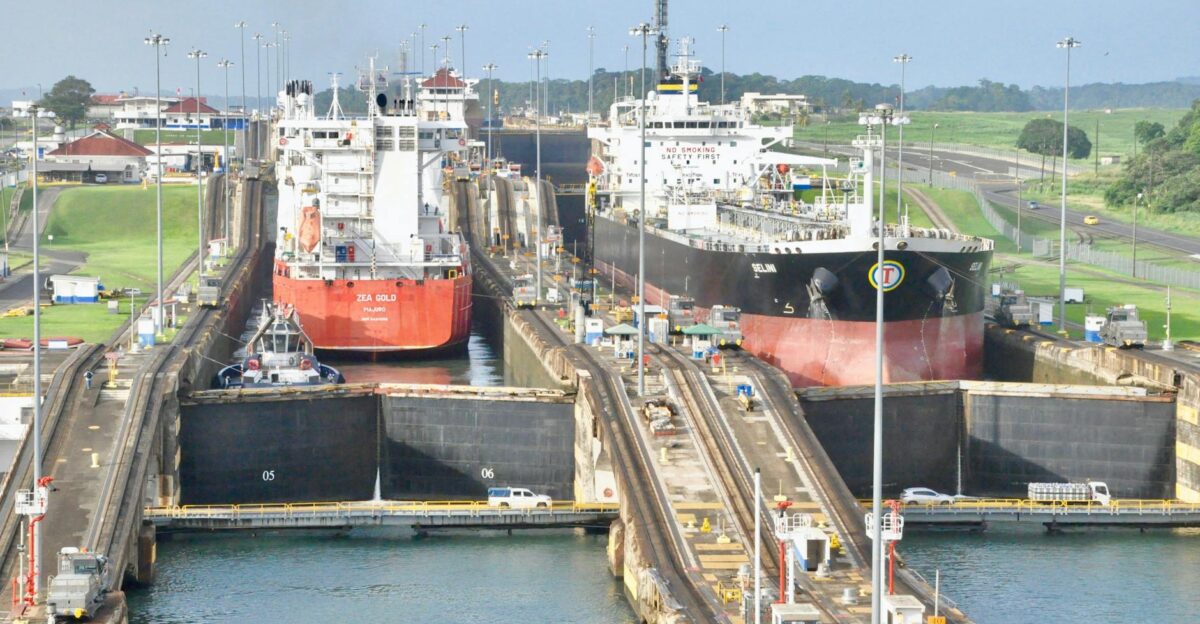 Cargo ships navigating the Panama Canal locks on a clear day showcasing a bustling transportation hub