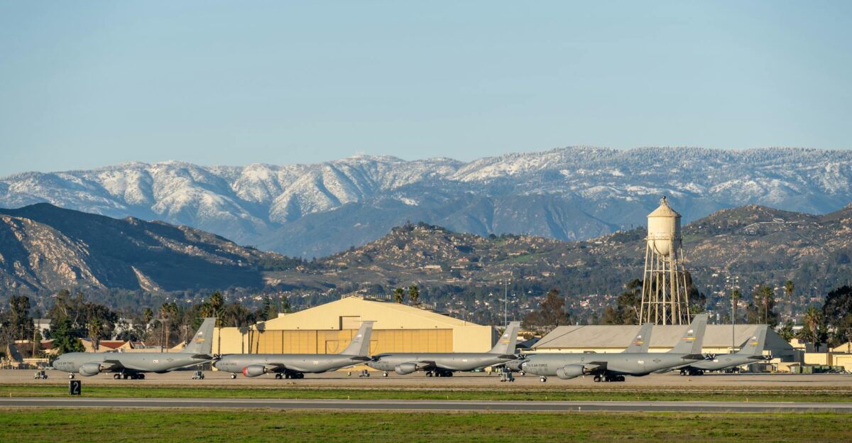 U S Air Force planes stationed at March Air Reserve Base with snow-capped mountains in the background