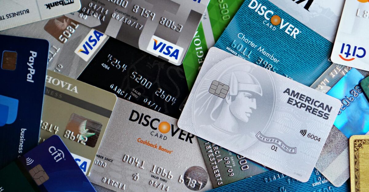 A flat lay of assorted credit and debit cards from various banks Ideal for finance and banking concepts
