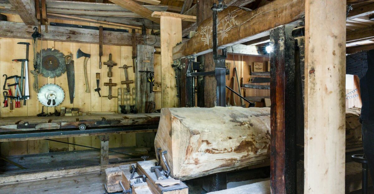 Explore the rustic interior of a traditional Swiss sawmill featuring woodworking tools