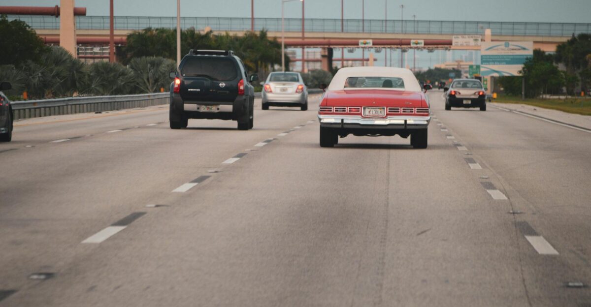 Highway traffic scene with classic car in Miami Florida showcasing urban travel atmosphere