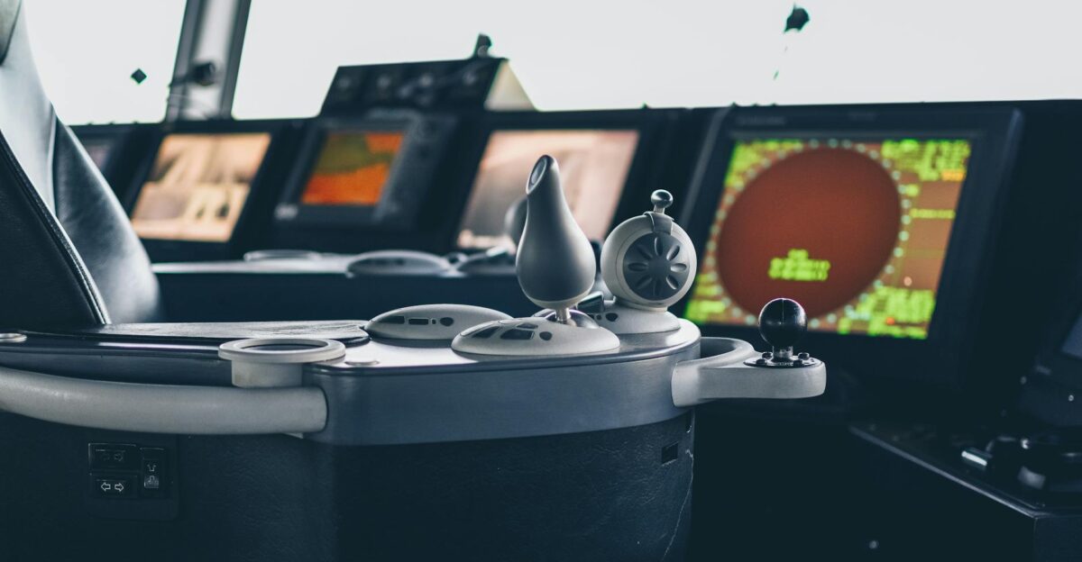 Close-up view of ship navigation controls and radar screens capturing maritime technology