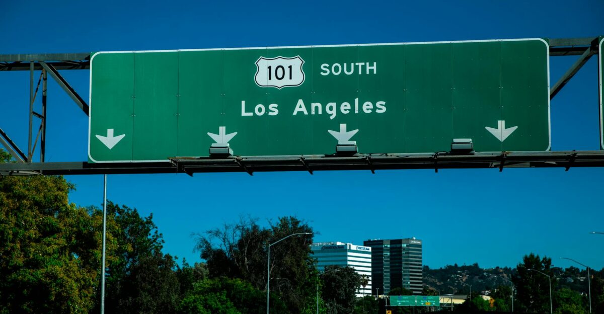 Scenic view of the Highway 101 South sign directing toward Los Angeles with traffic below