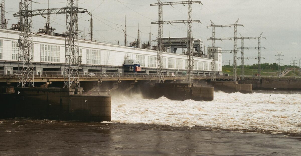 Hydroelectric dam with electric towers generating energy in Russia during the day