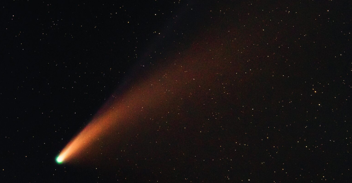 A vibrant comet with a glowing tail traversing the starry night sky, showcasing the wonders of the universe.
