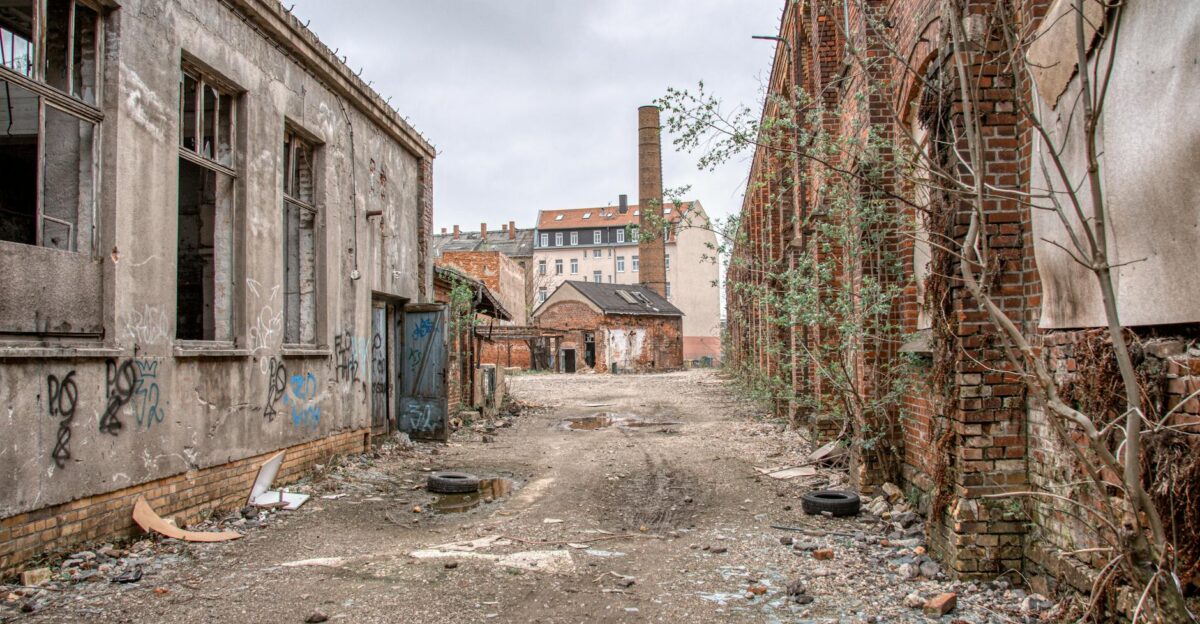 Explore the abandoned and overgrown industrial site on a cloudy day in Leipzig