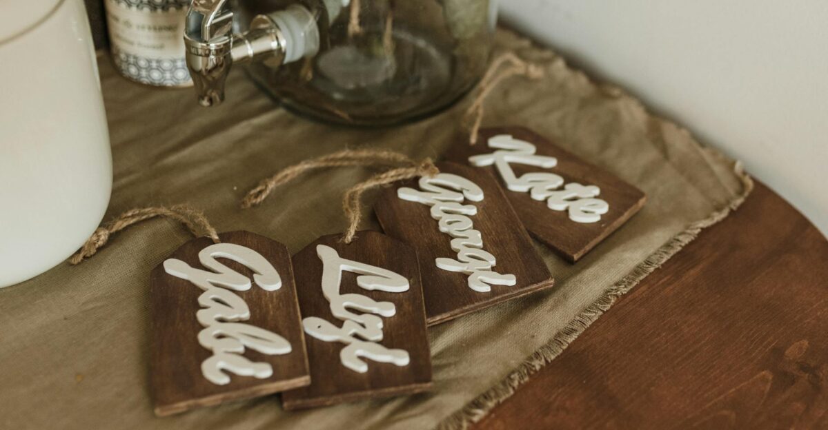 Charming wooden name tags with elegant script on a rustic tabletop setting
