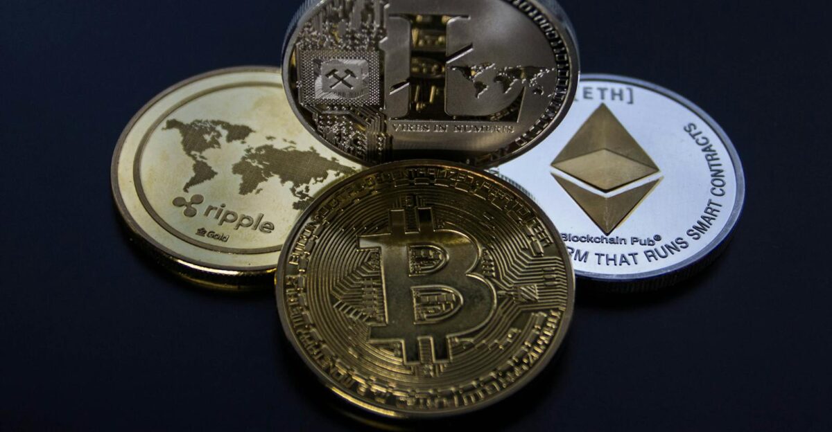 Detailed photo showcasing bitcoin ethereum litecoin and ripple coins representing digital currency