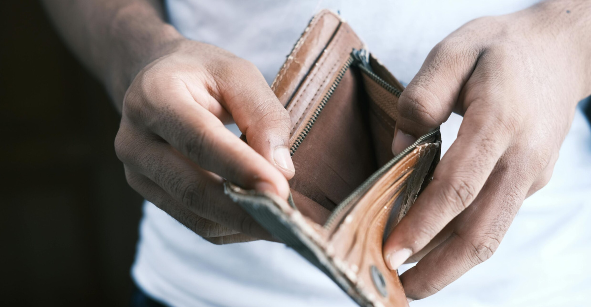 Close-up of hands holding an empty wallet, highlighting financial struggles and economic crisis.