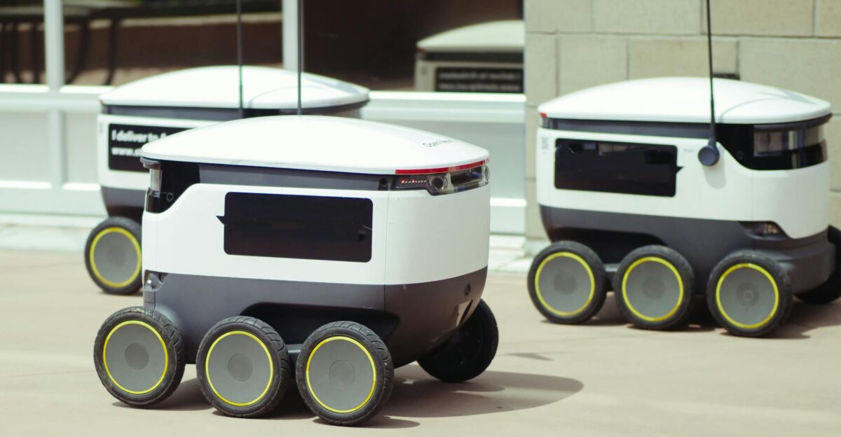 Advanced autonomous delivery robots in an outdoor urban setting showcasing modern technology