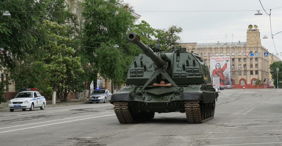 A military tank and police cars on a street in Volgograd Russia