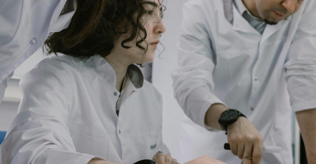 Group of scientists working together in a lab focused and collaborative atmosphere