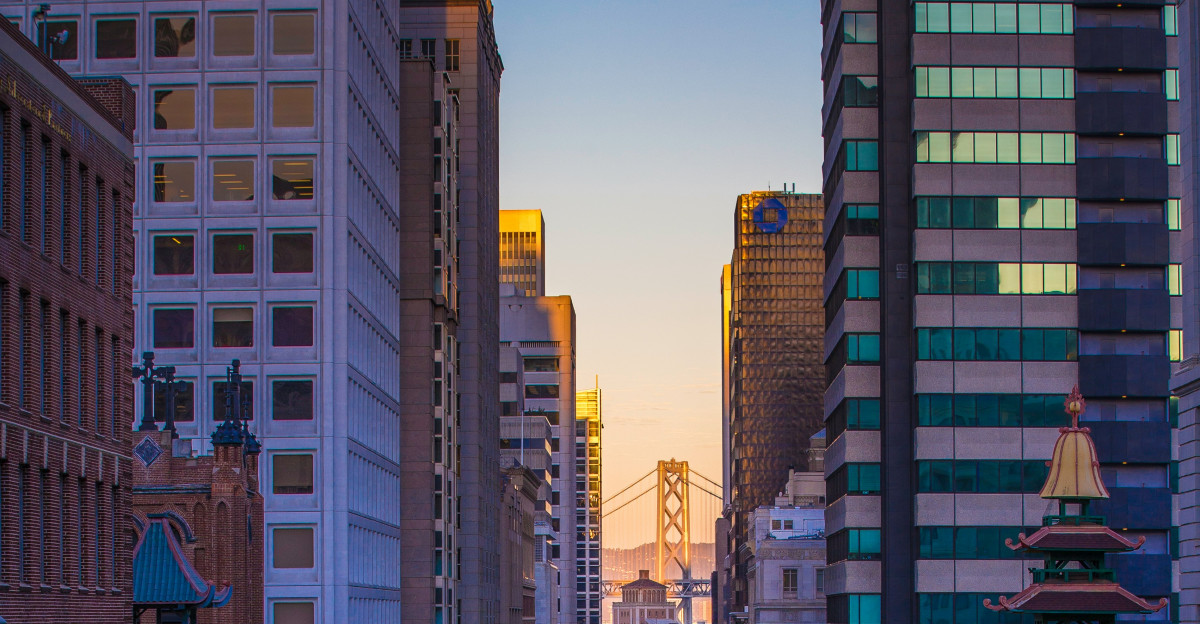 car lot surrounded by high rise building