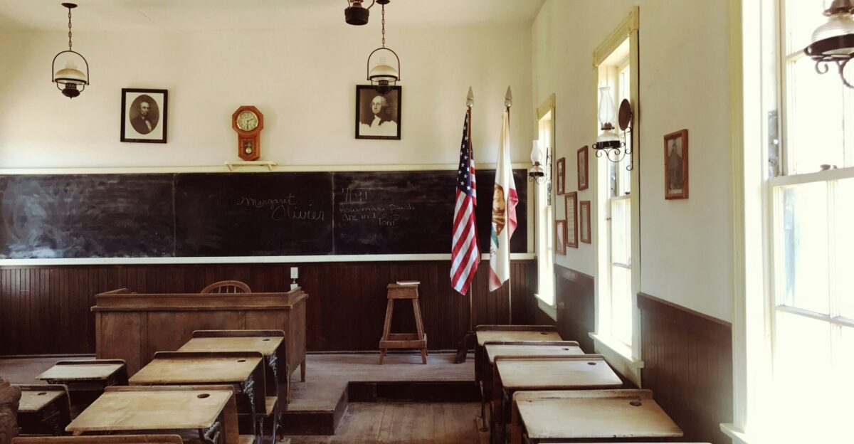 flag of USA standing near blackboard