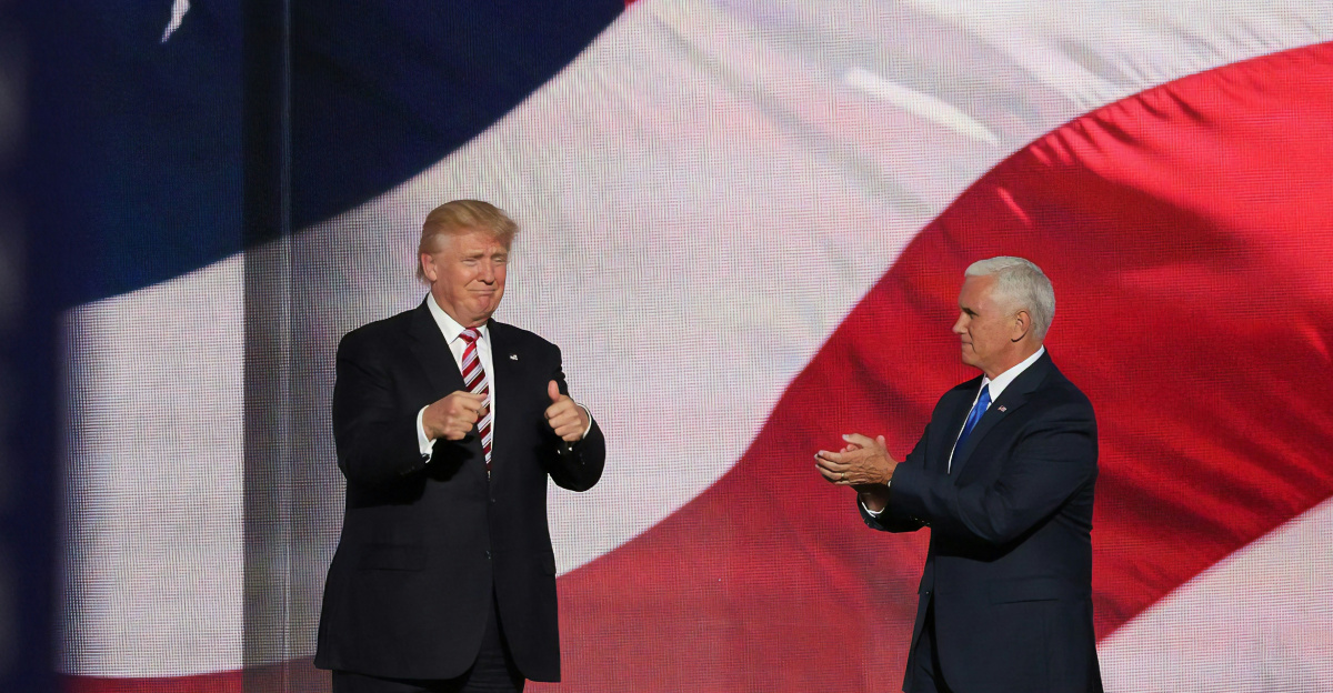 Donald Trump beside man in black suit