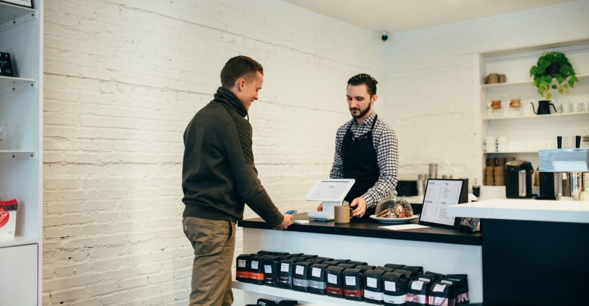 man buying item in shop