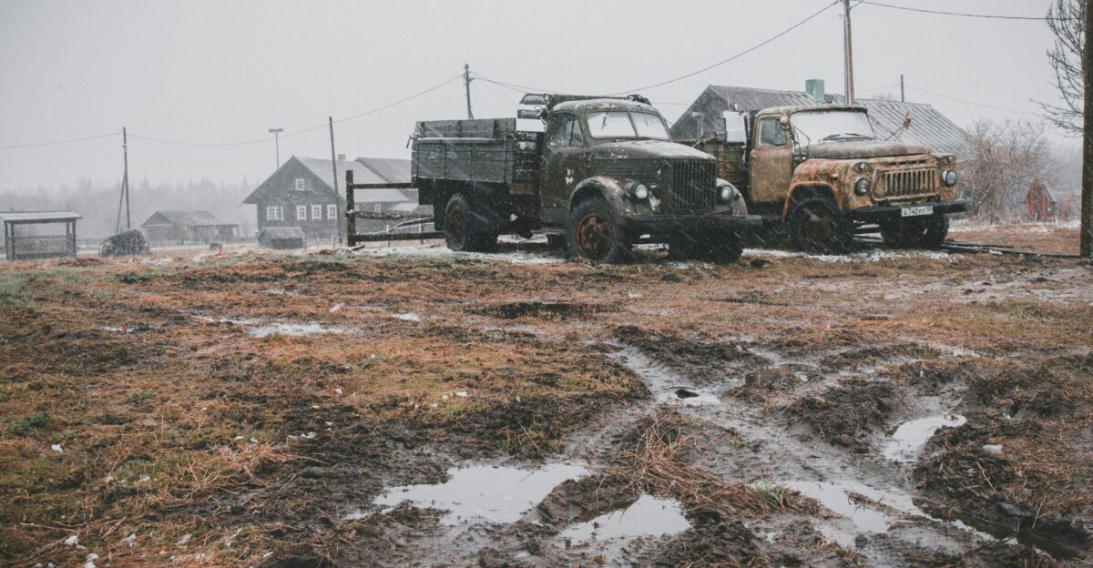 two trucks parked near electric post
