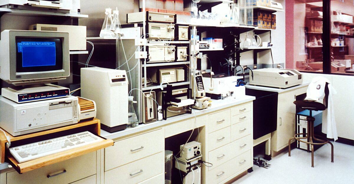 desktop monitor beside computer tower on inside room