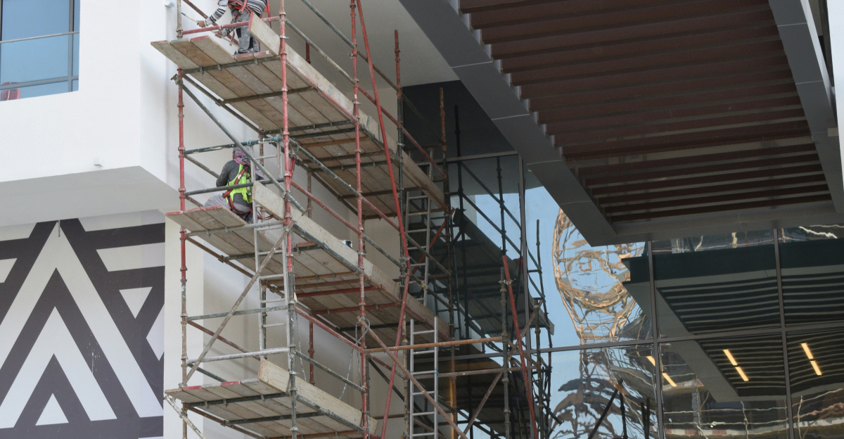 brown wooden spiral staircase near white wall