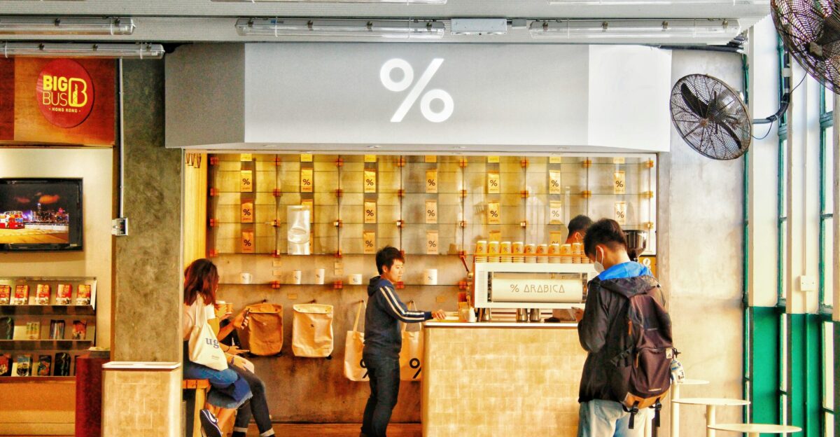 people standing in front of brown wooden table