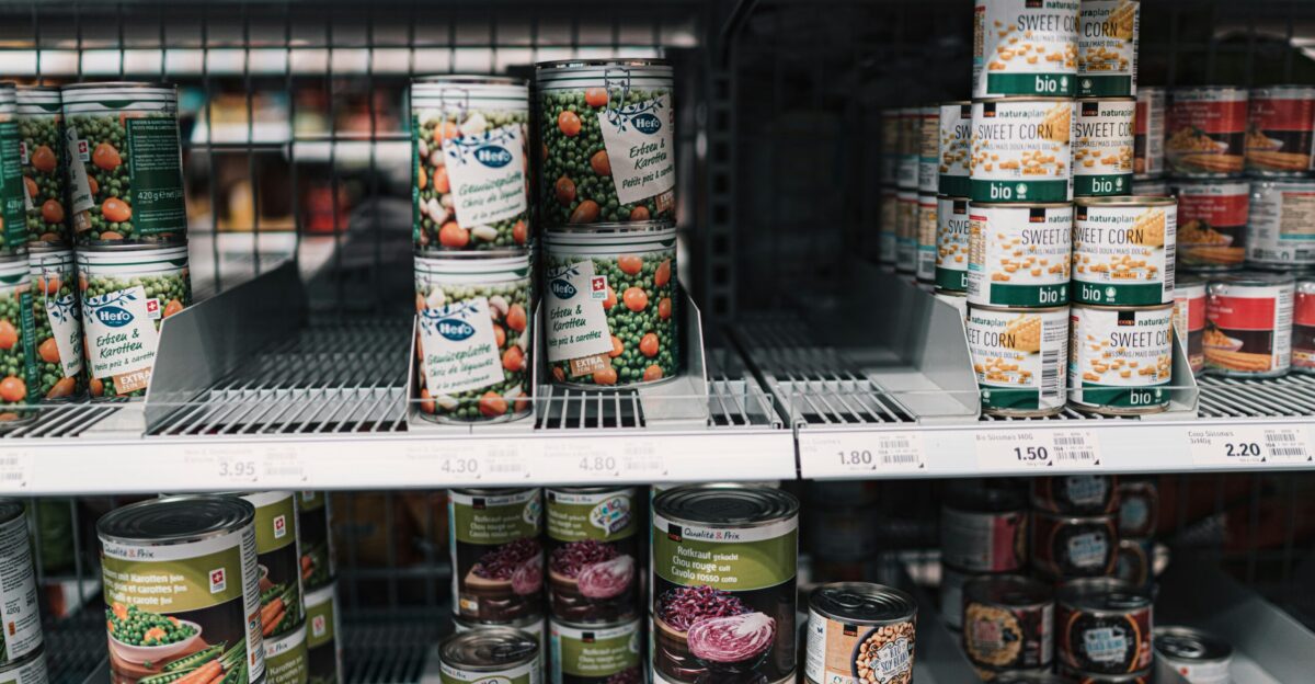 white and red labeled cans