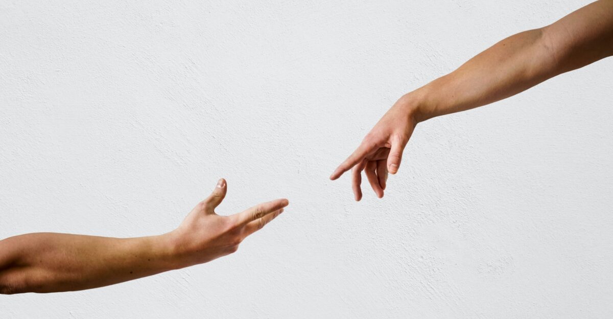 persons hand on white wall