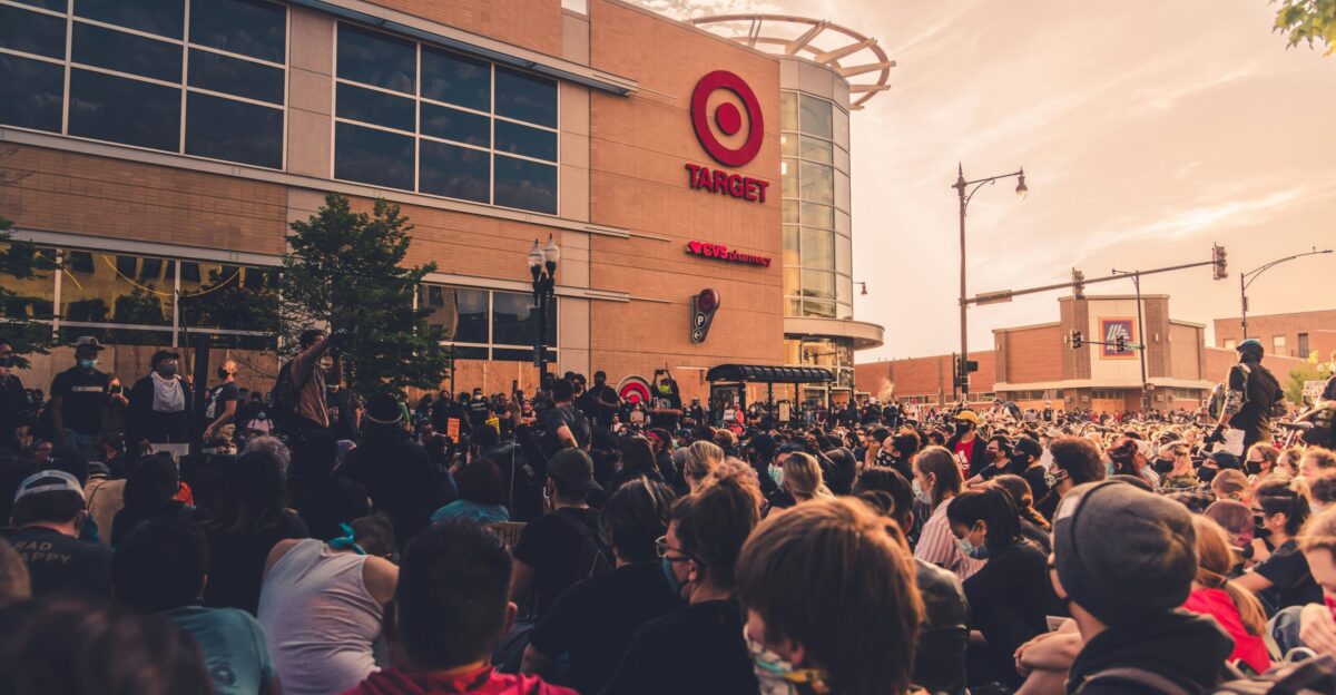people gathering in front of brown building during daytime