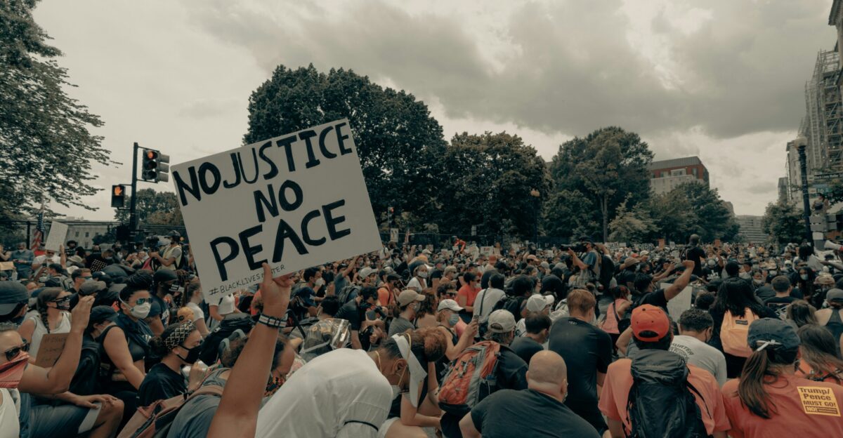 a large crowd of people holding up signs