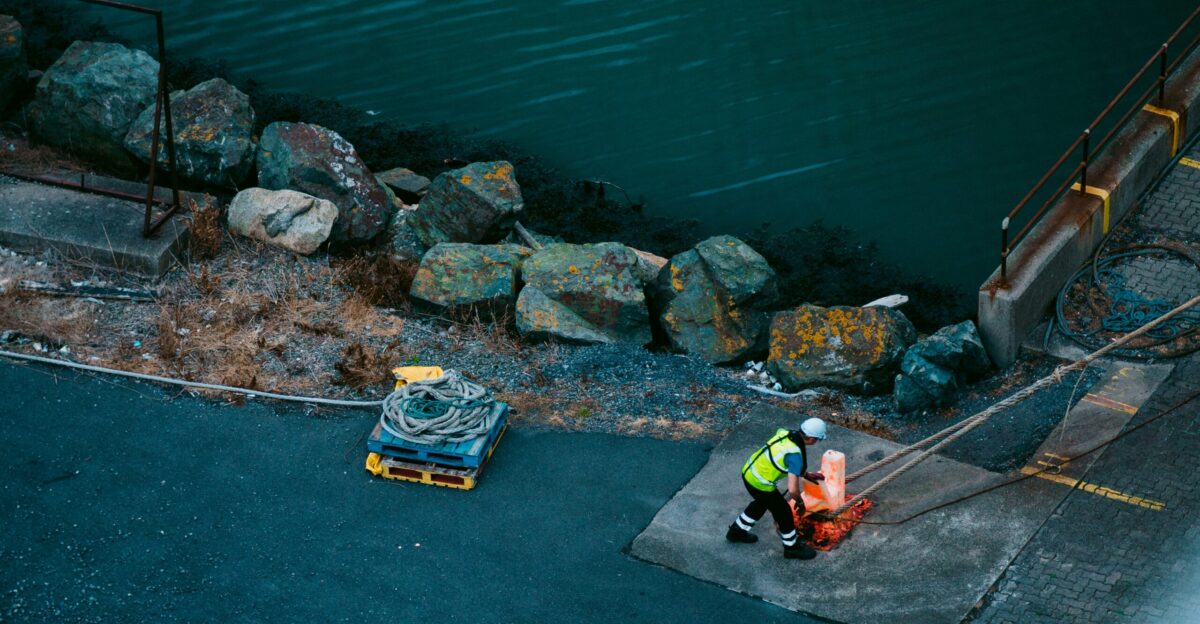 yellow and blue boat on body of water during daytime