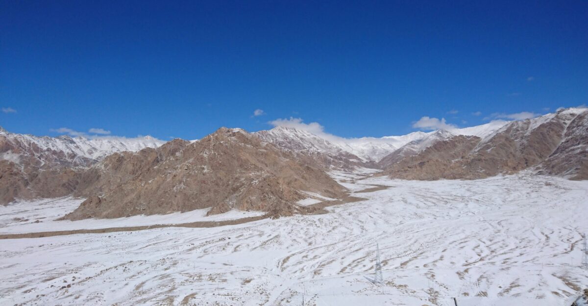 people walking on snow covered field during daytime