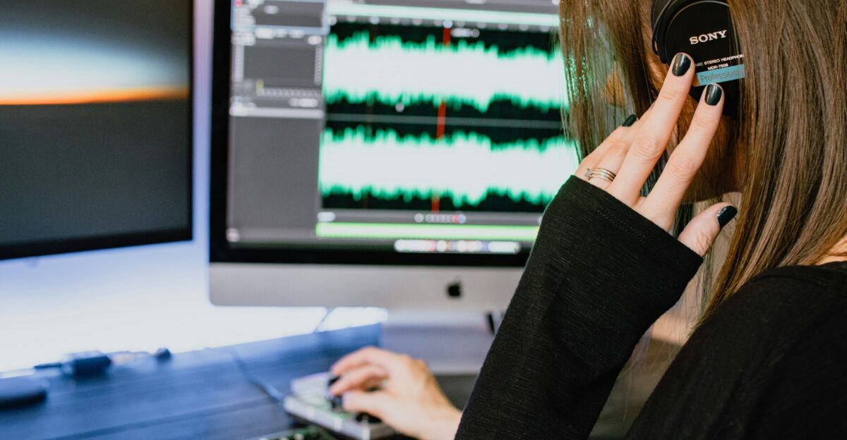 woman in black long sleeve shirt using black laptop computer
