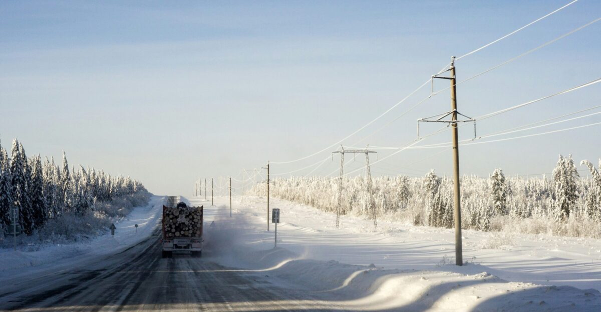 snow covered road during daytime