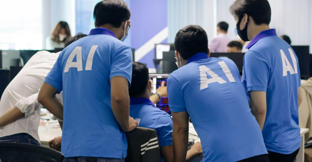 man in blue nike crew neck t-shirt standing beside man in blue crew neck t