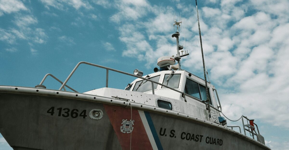 white red and blue boat on sea during daytime