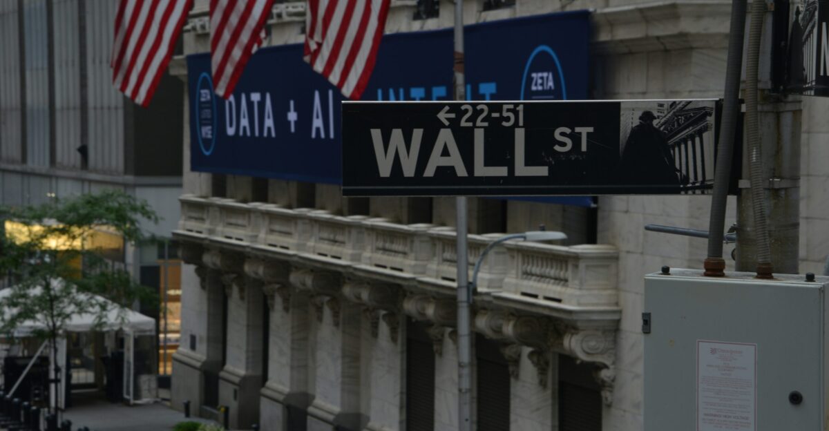 a street sign on wall street in new york city