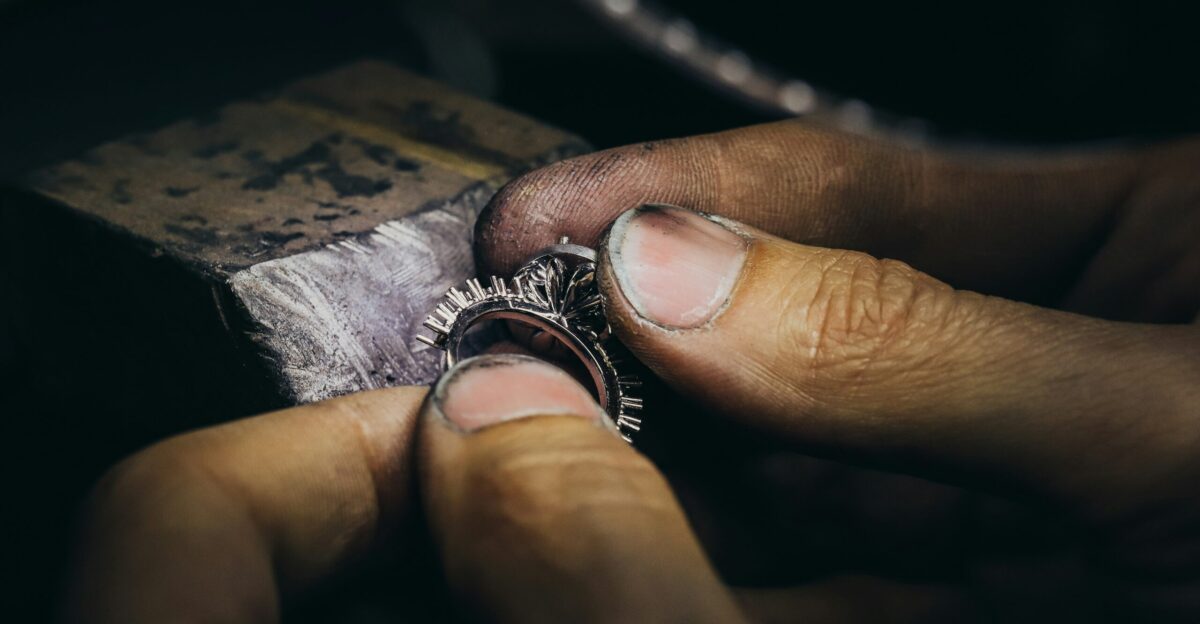 silver ring on persons finger
