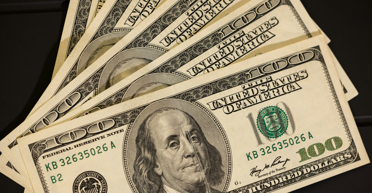 a stack of twenty dollar bills sitting on top of each other