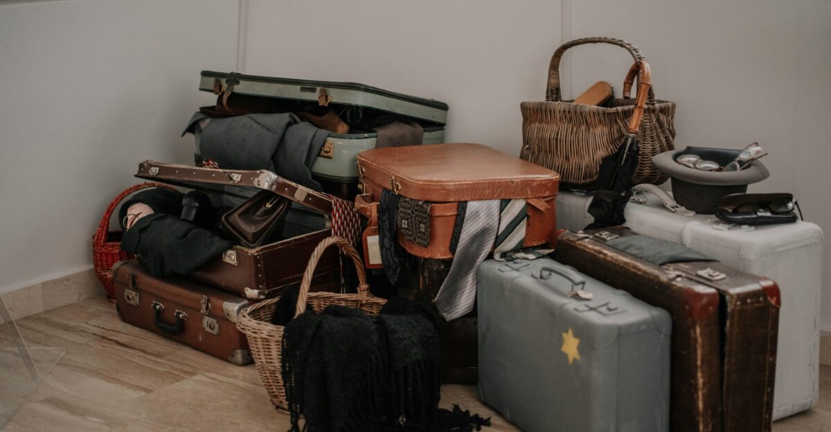 a pile of luggage sitting on top of a hard wood floor