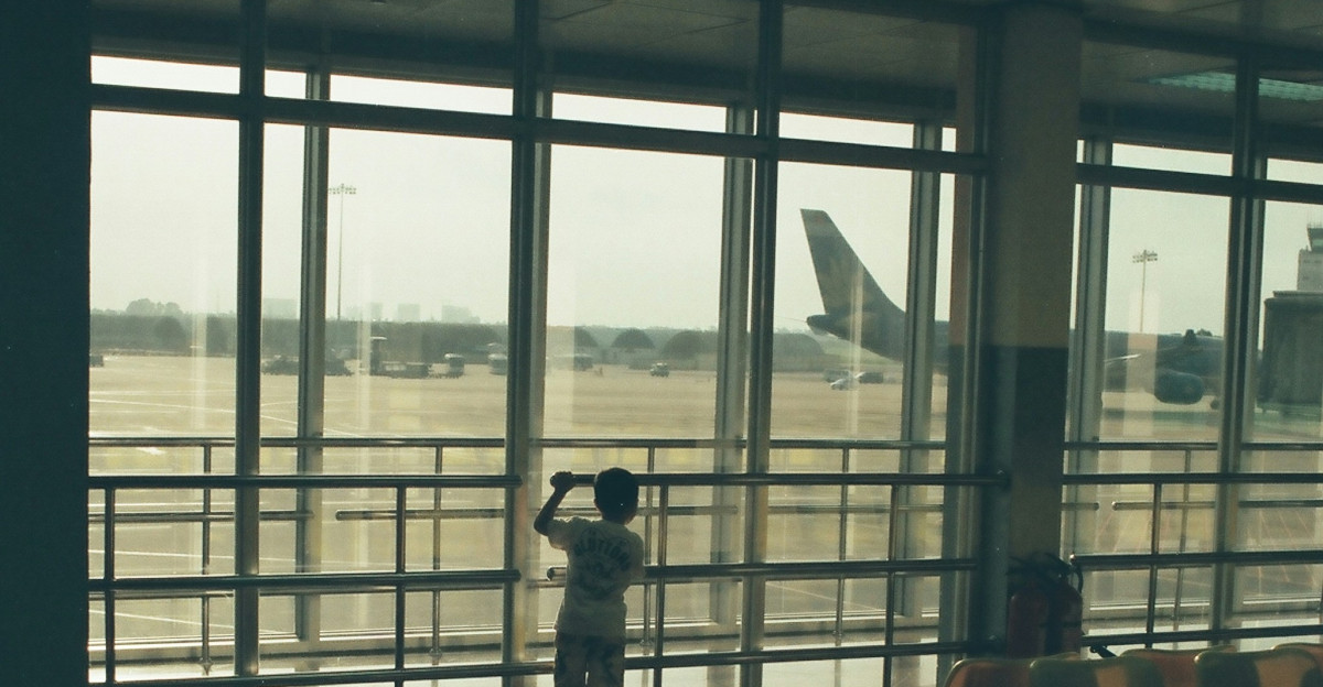 a person taking a picture of an airport