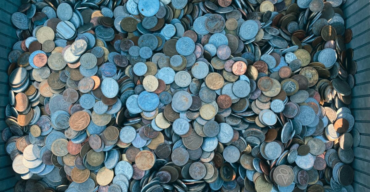 a bin filled with lots of different types of coins