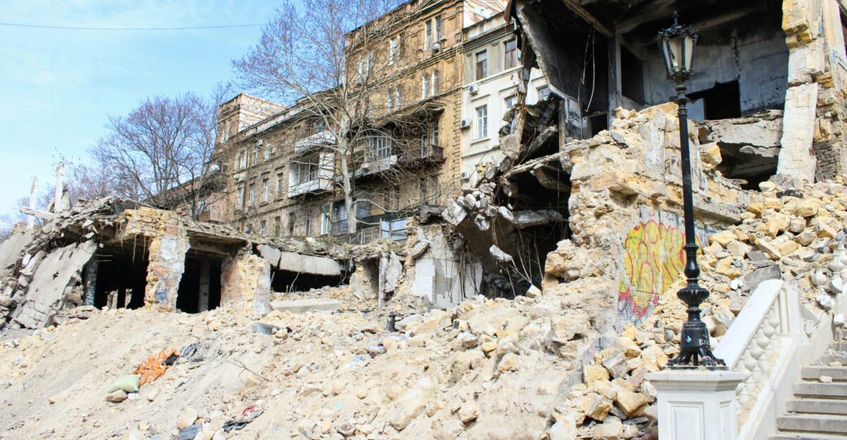 a large pile of rubble next to a building