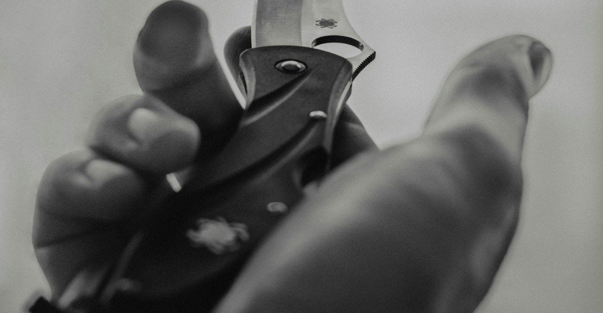 a person holding a pair of scissors in their hand
