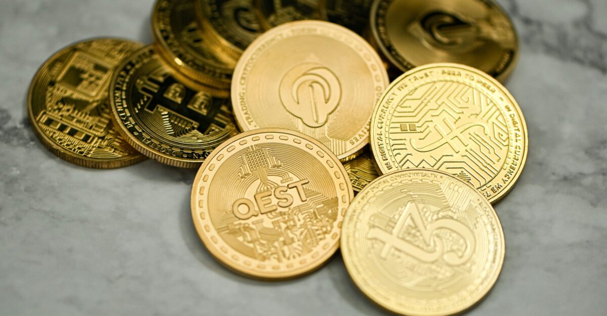 a pile of gold coins sitting on top of a table